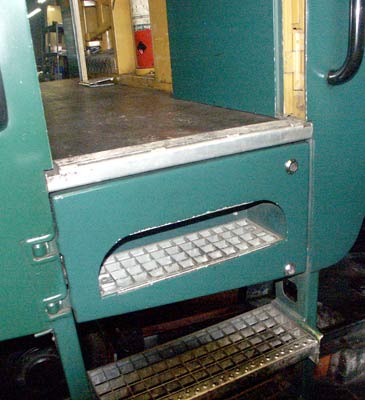 The batteries on the H2/3 locomotives are under the cab floor. Access is via the top step which is hinged. October 8 2003