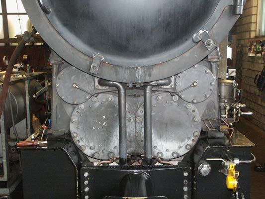 A view of BRB 15's cylinder block. Interestingly in view of the high degree of insulation elsewhere on the locomotives the cylinder and valve covers are not insulated at all. The pipes leading from between the valves down below the cylinders take exhaust steam to the feedwater heater. October 8 2003