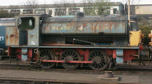 'Austerity' 0-6-0st type RSH No. 7289 'Fred' sits at Tyseley Locomotive Works. Note the vacuum brake pipework on the running plate - a preservation days addition. I assume it was not always in the current position ! April 13 2003.