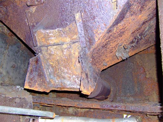 This hopper fed coal from the bunker above into the underfeed stoker trough via the hatch shown. Obviously on this example the stoker has been removed! 10 June 2006