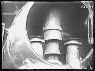 A view (taken from video) showing the partially completed smokebox arrangement. Central is the Kylchap exhaust, to either side are the mainsteam pipes which both lack their top sections connecting to the superheater header. 1949