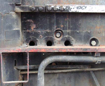 Three of the four overfire air holes in the firebox side of a RFIRT 2-10-2. January 2004