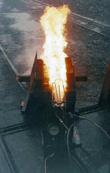 One of the burner experiments. Note the loops of pipework towards the rear of the flames. These superheat the atomising steam. Superheat is an important improvement for all oil firing systems. &copy; Nigel A. H. Day