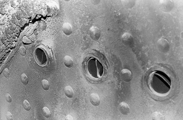 The over fire air holes as viewed from the inside of the firebox. Note the swirl inducers within the holes designed to help gas mixing in the firebox. November 1993.&copy; Shaun McMahon 