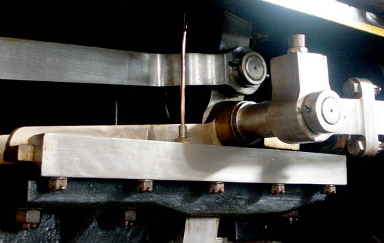To allow the Walschaerts valves gear to drive the oscillating cam an extension protrudes at 90&deg; to what would be the valve steam crosshead on a piston valve engine. This extension allows the rod driving the cam to clear the outside face of the cylinder. October 9 2003
