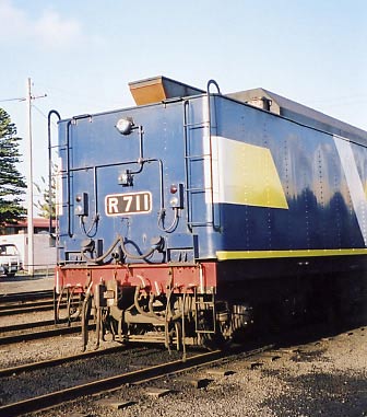 The rear of R711's tender showing the altered tender tank filler, the lighting, multiple working gear and additional brake control pipes. September 2001.