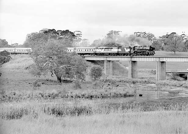 R711 & S302 cross Mount Emu Creek viaduct on the 08:48 Melbourne Spencer Street to Warrnambool service. September 2001.