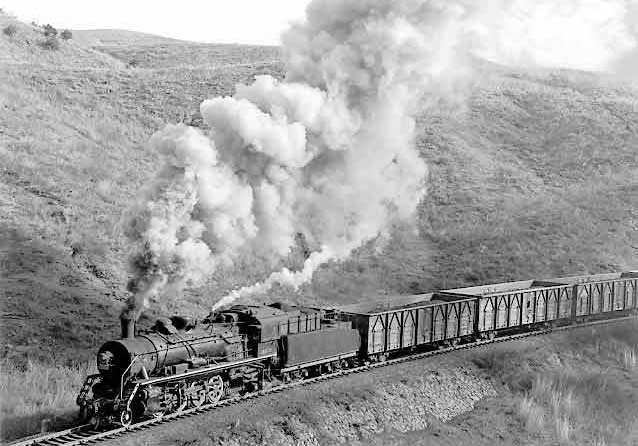 A loaded train climbs towards the first tunnel on the Chengde steelworks branch headed by an SY 2-8-2. February 1999