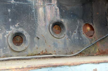 These three holes in the firebox side cladding should line up with the overfire air holes! April 13 2003