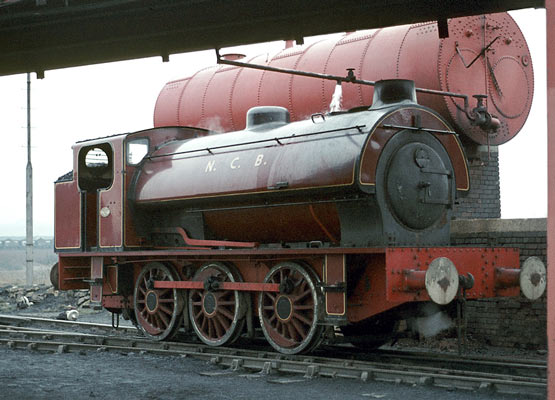 Hunslet No.2879 of 1943. 'Diana' takes water (very slowly!) at Wheldale colliery in 1971. The reversing rod has been cranked to avoid the overfire airholes in the firebox side. © Geoff Plumb