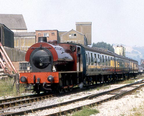 The 'Austerity' type locomotive has become popular, if somewhat unloved, on UK preserved railways. This is especially true of lines operating on old BR formations where this type of loco is used prior to the availability of BR types. In many cases the 'Austerities' are looking for a new home once the BR types are available. Here 'Warrington', is seen leaving Darley Dale on Peak Rail with a passenger service to Matlock. July 31 1992 