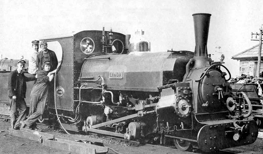 Ffestiniog Railway 2-4-0 saddle tank "Linda" ex-works at Boston Lodge in March 1985 at the commencements of tuning-up trials. Left to right: Driver Bell, Fireman Brooks, the author, and, leaning on the cabside, Jo Clulow, "coal bunker maker extraordinaire", and driver of the first successful working to Tan-y-Bwlch. © G. Rushton